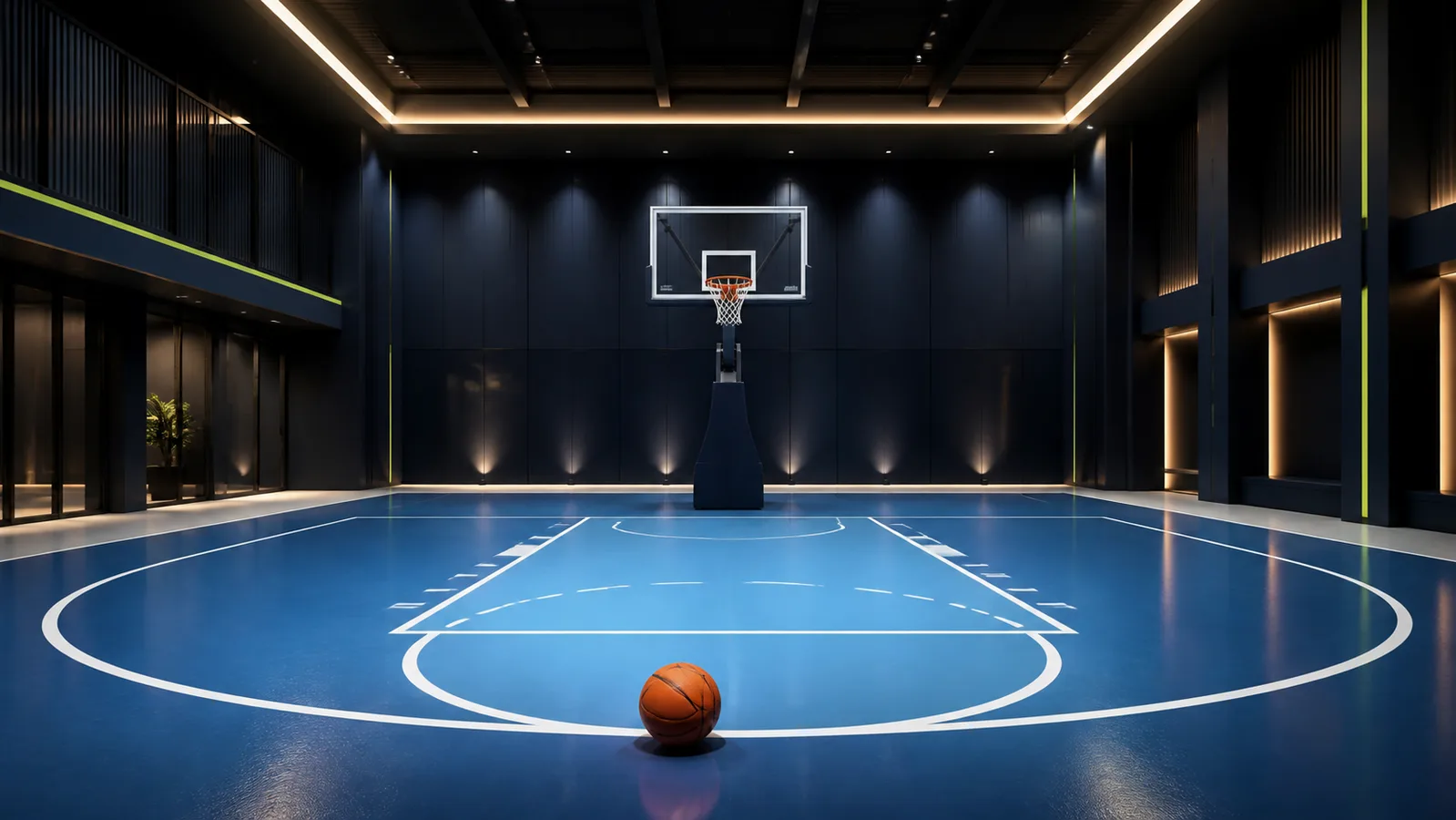 Basketball resting on an indoor court beneath a basketball hoop